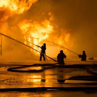 Fireman putting out a house fire