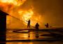 Fireman putting out a house fire